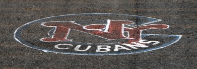 New York Cubans logo painted on asphalt surface of Hichliffe Baseball field