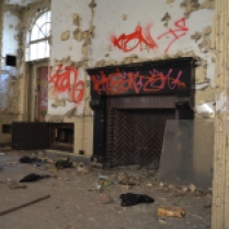 Red brick fireplace at rear of abandoned Greenpoint Hospital building