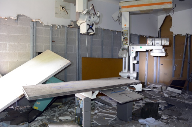 Damaged X-Ray Machine & Table in smashed up hospital room