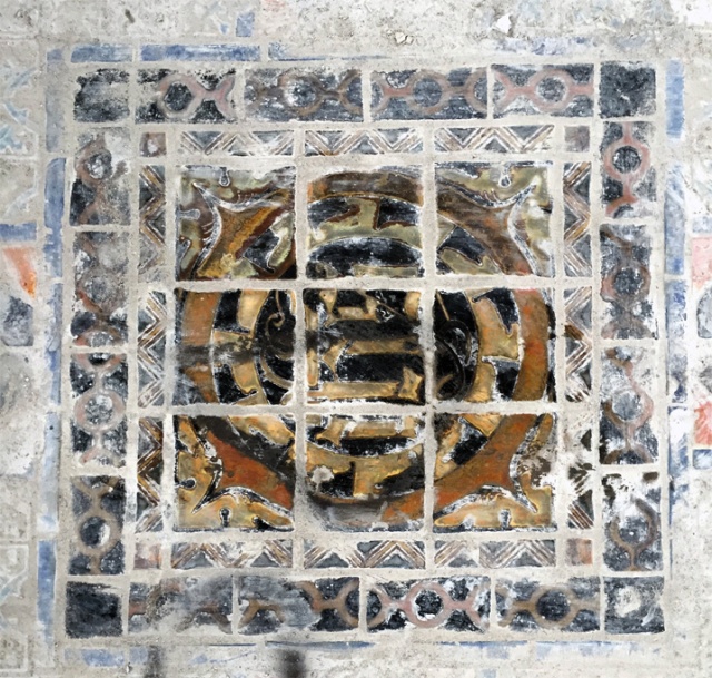 Glazed tile on church floor covered with dust